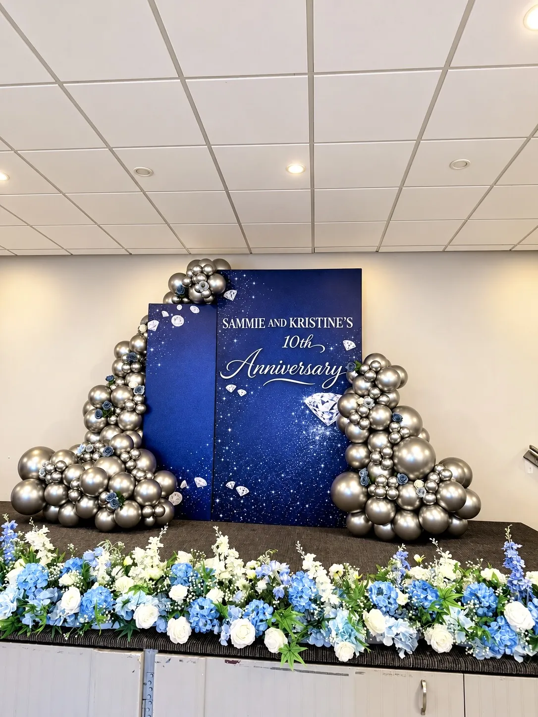 10th anniversary navy and silver balloon backdrop
