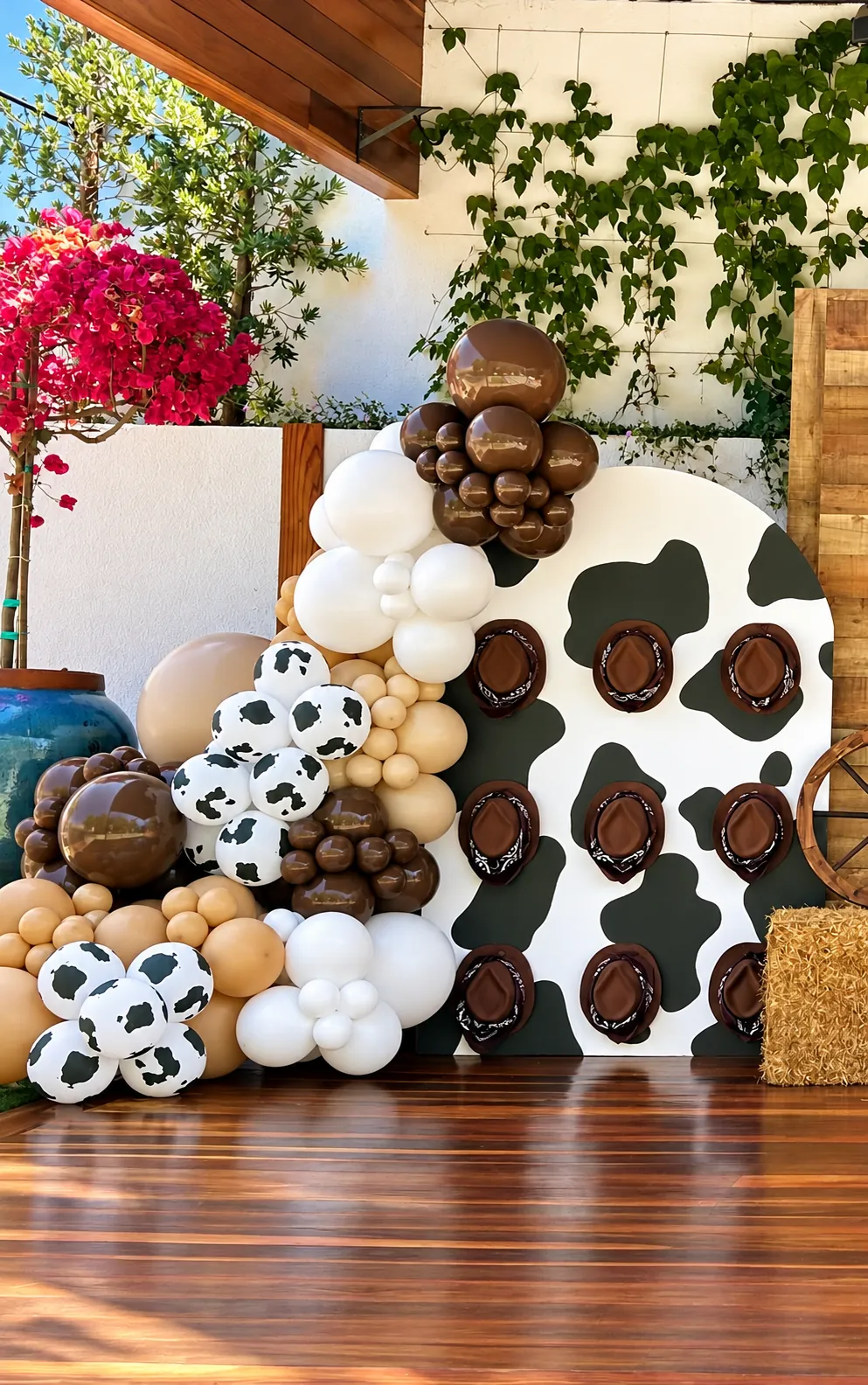 Cow print themed custom backdrop with balloons